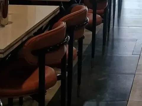 Rounded leather chairs, The main dining hall